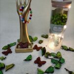 Handmade bracelet made of cube shaped beads with Arabic alphabet prints and mixed color beads.                                                       سوار مصنوع يدويا يتكون من الخرز ذو الألوان الزاهية مع مكعبات حروف اللغة العربية