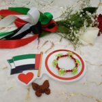 Handmade bracelet of red beads and flower shaped green beads in special design.