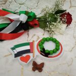 Handmade bracelet from wooden green beads and black ribbon.